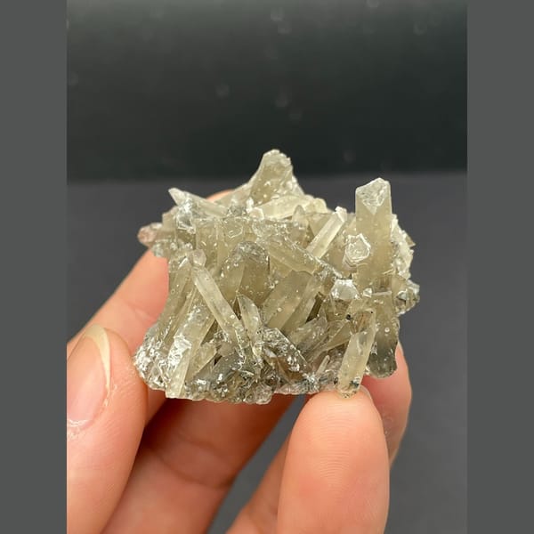 Spray of slender grey quartz crystals from Inner Mongolia — alternate view
