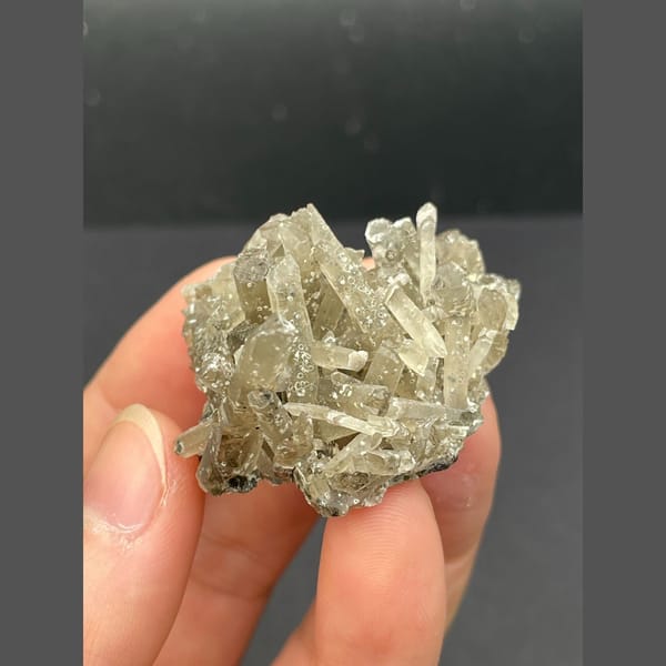 Spray of slender grey quartz crystals from Inner Mongolia — alternate view