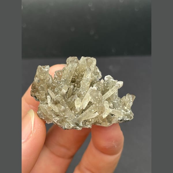 Spray of slender grey quartz crystals from Inner Mongolia — detail view