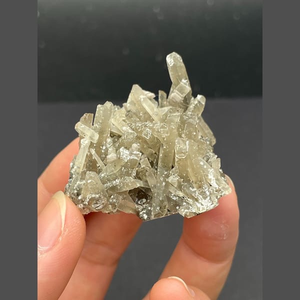 Spray of slender grey quartz crystals from Inner Mongolia — detail view