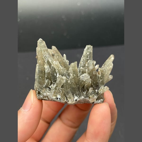 Radiating star-like grey quartz cluster from Inner Mongolia — detail view