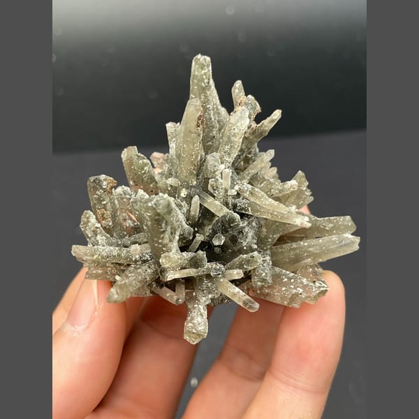 Radiating star-like grey quartz cluster from Inner Mongolia — detail view