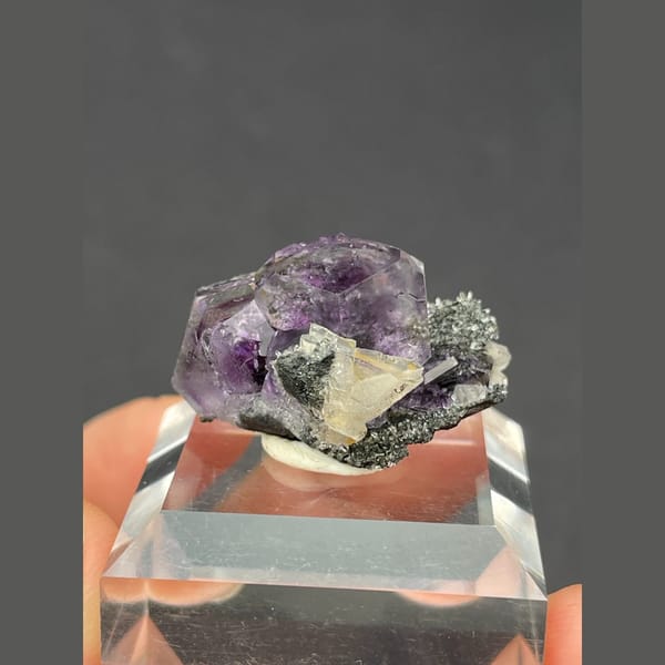 Small tanzanite blue-violet fluorite on matrix from Fujian — complete view
