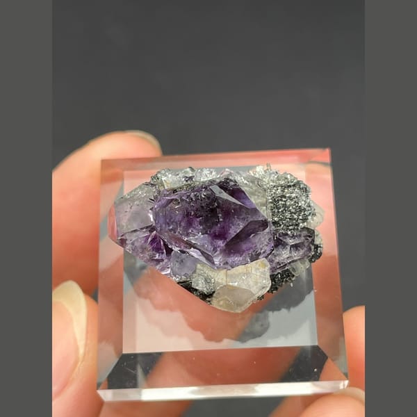 Small tanzanite blue-violet fluorite on matrix from Fujian — alternate view