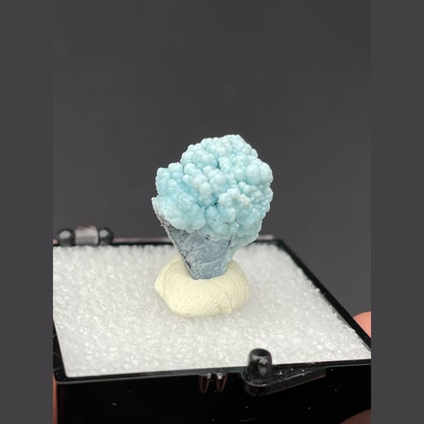 Small rounded pale blue gibbsite spheres from Yunnan — alternate view