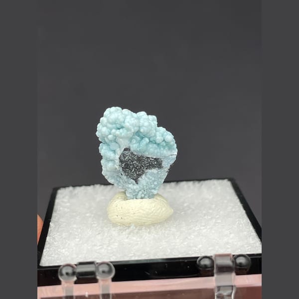 Small rounded pale blue gibbsite spheres from Yunnan — detail view