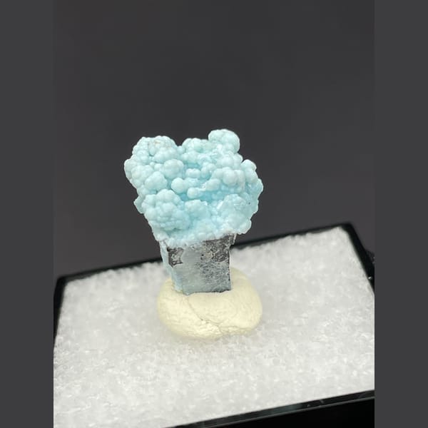 Small rounded pale blue gibbsite spheres from Yunnan — detail view