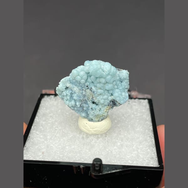 Cluster of frosted pale blue gibbsite spheres from Yunnan — alternate view