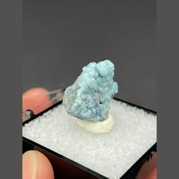 Cluster of frosted pale blue gibbsite spheres from Yunnan — alternate view
