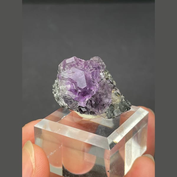 Tanzanite blue-violet fluorite on dark matrix from Fujian — alternate view