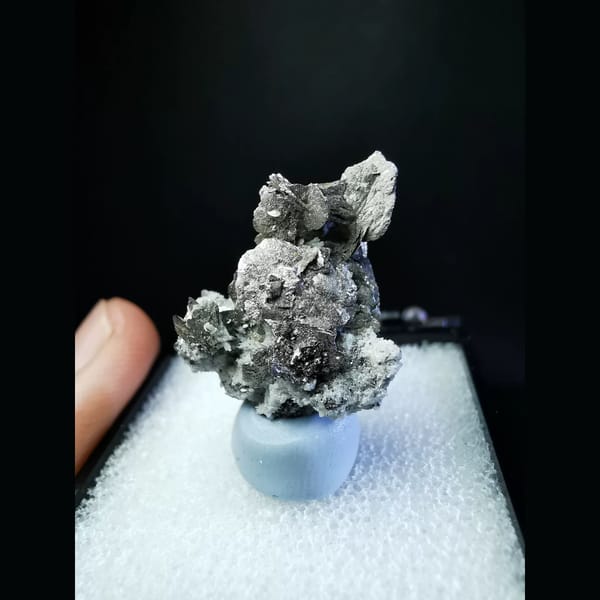 Bright silver platy loellingite with quartz — complete view
