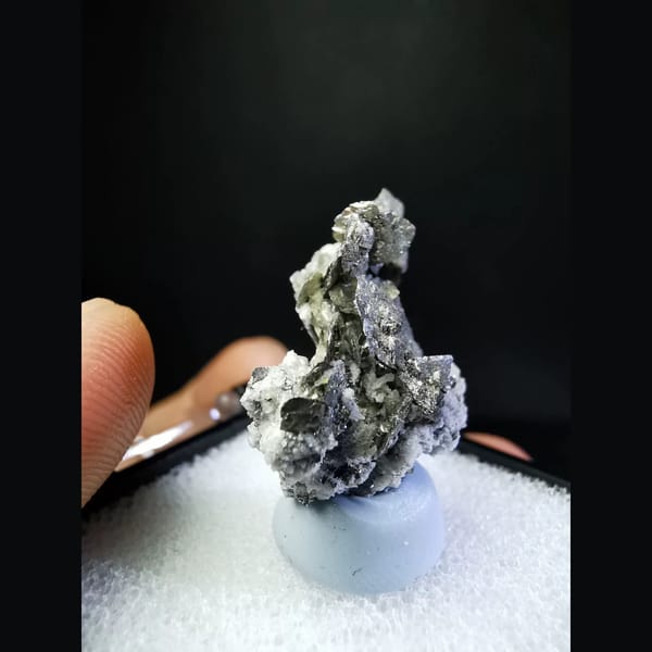 Bright silver platy loellingite with quartz — alternate view