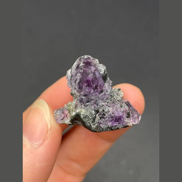 Cluster of tanzanite blue-violet fluorite on matrix from Fujian — complete view