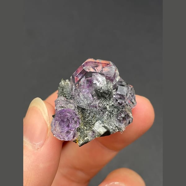 Cluster of tanzanite blue-violet fluorite on matrix from Fujian — alternate view