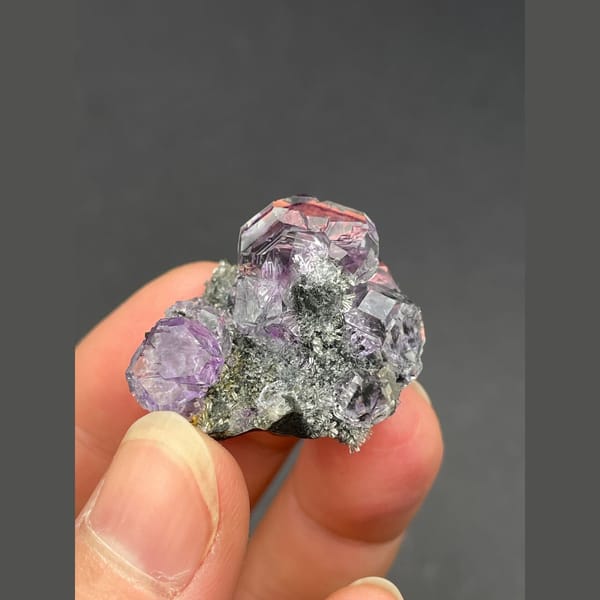 Cluster of tanzanite blue-violet fluorite on matrix from Fujian — alternate view