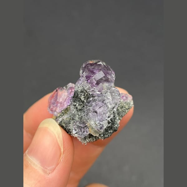 Cluster of tanzanite blue-violet fluorite on matrix from Fujian — detail view