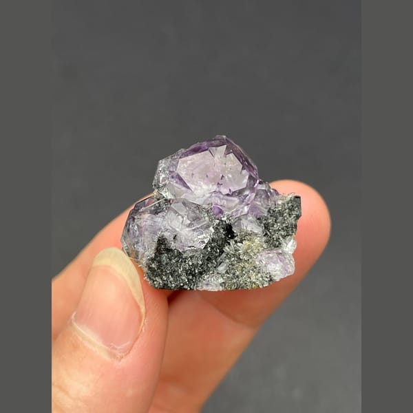 Cluster of tanzanite blue-violet fluorite on matrix from Fujian — detail view