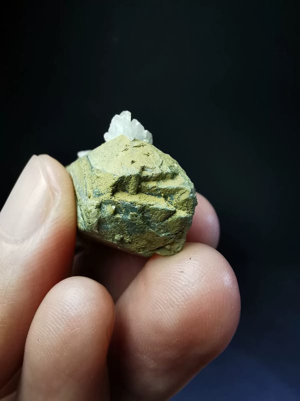 Yellow-coated double-terminated quartz with white calcite — complete reverse and base view
