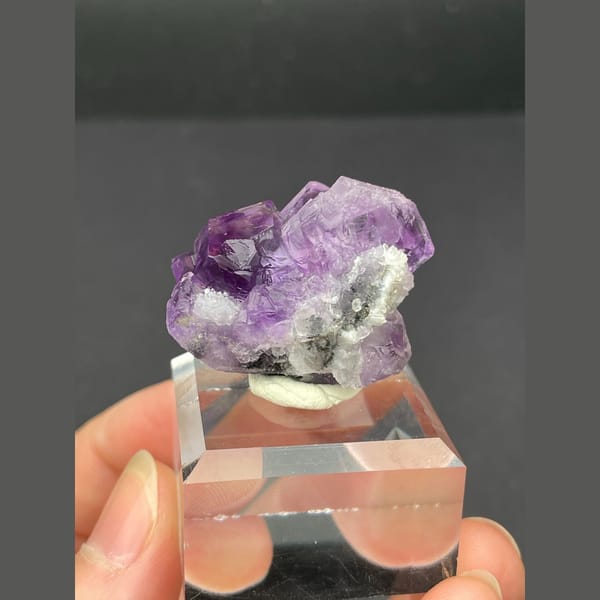 Small vivid purple fluorite cluster from Fujian — complete view