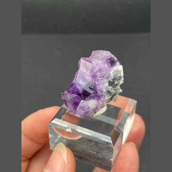 Small vivid purple fluorite cluster from Fujian — alternate view
