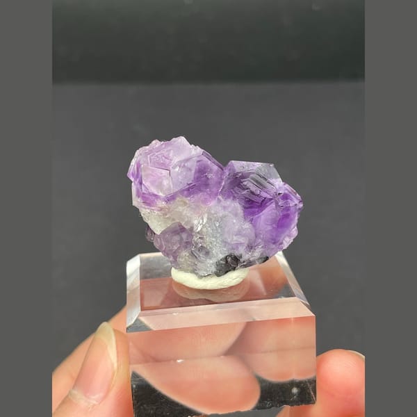 Small vivid purple fluorite cluster from Fujian — detail view