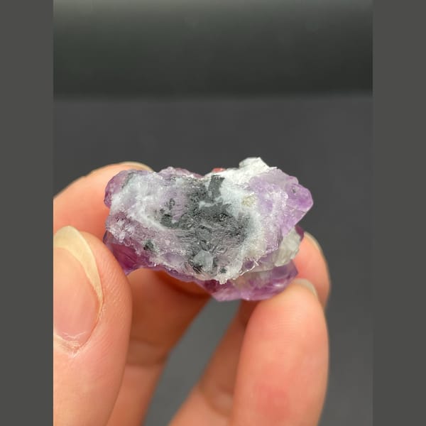 Small vivid purple fluorite cluster from Fujian — detail view