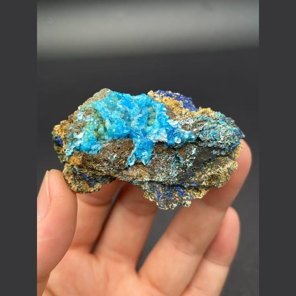 Sky-blue gibbsite crust with deep blue azurite on matrix from Yunnan — complete view