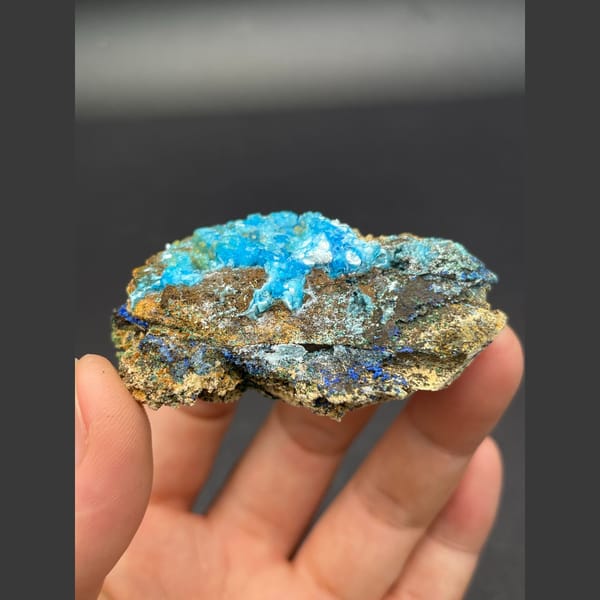 Sky-blue gibbsite crust with deep blue azurite on matrix from Yunnan — detail view