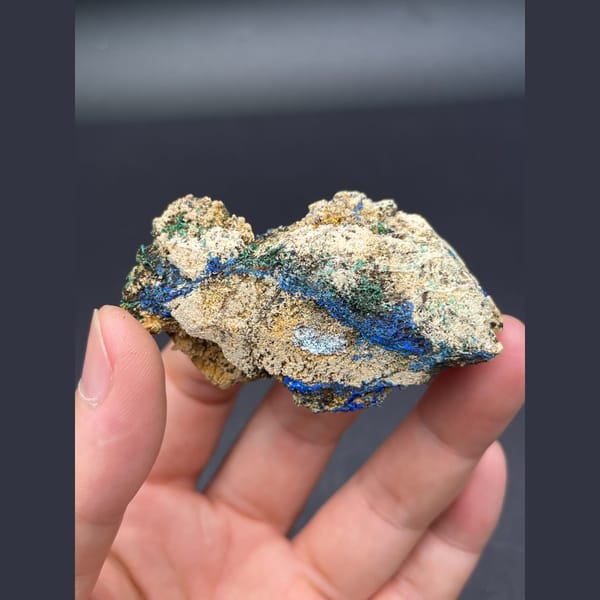 Sky-blue gibbsite crust with deep blue azurite on matrix from Yunnan — detail view
