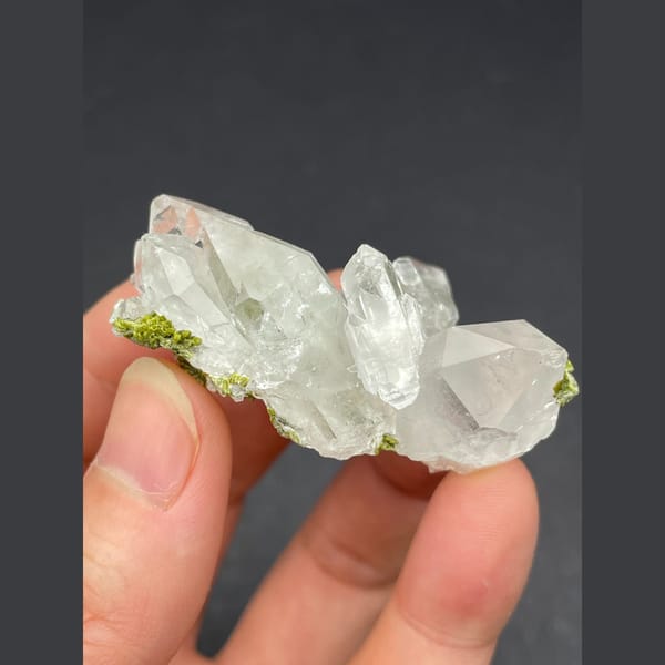 Water-clear quartz cluster with green epidote from Meigu, Sichuan — alternate view