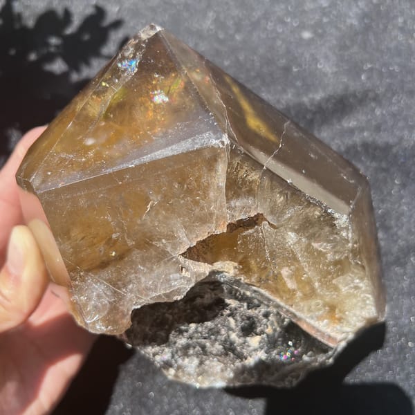 Underside of the citrine with a darker crystalline pocket and rough break