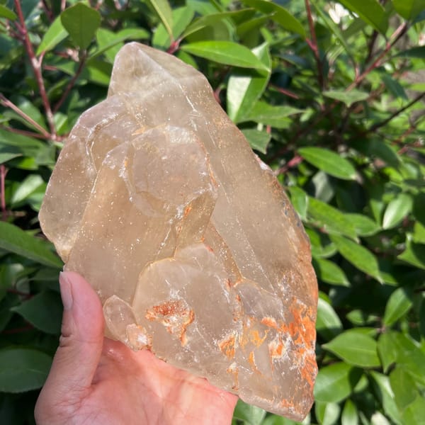 Front of the Zambian citrine with stepped terminations and orange accents
