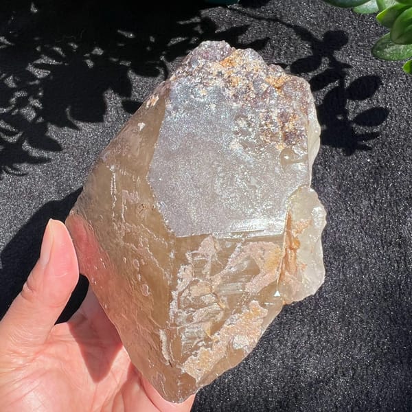 Frosted panel on a citrine face with lepidolite flecks at the top