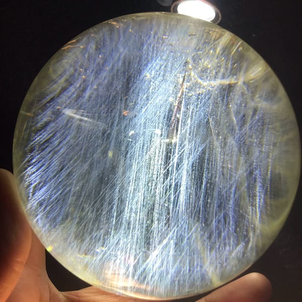 Citrine sphere with vertical blue needle columns and pale yellow rim