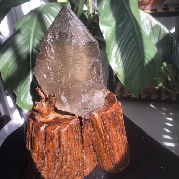 Citrine skeletal point on stand viewed from the right side