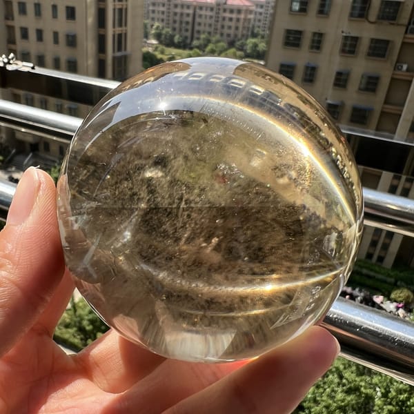 Hazy smoky interior visible when the sphere is turned toward the shade