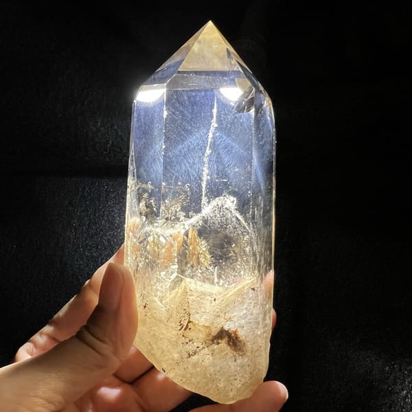 Front of the citrine point with phantom ridge and warm crackled base