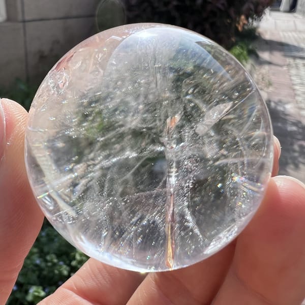 Clear side of the sphere showing soft internal veils and fractures
