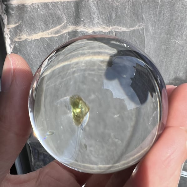 Side angle where the green mica flake appears edge-on and narrow