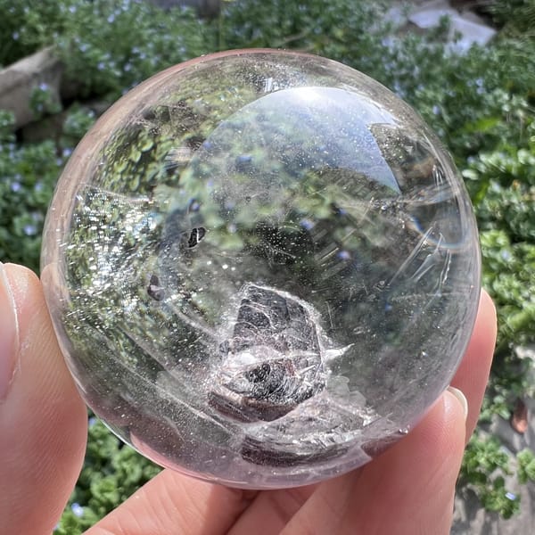 Mica flower with a frosted silver rim and glitter scattered through the quartz