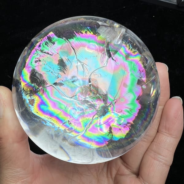 Rainbow-covered face of the sphere with a pale inclusion near the top