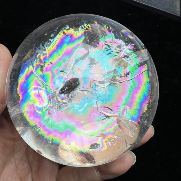 Rainbow rings surrounding a darker reflected zone in the centre