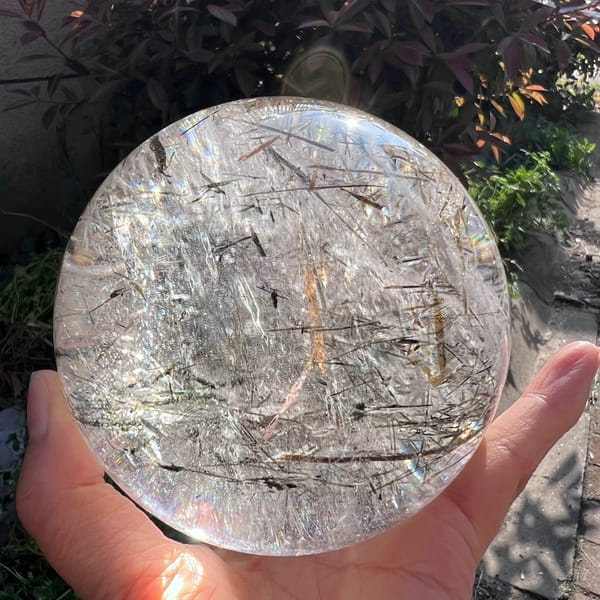 Paler side of the sphere with fine mica blades and bright reflections