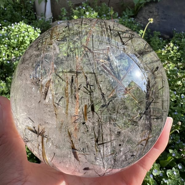 Mica-laden sphere filling the frame, blades running in all directions