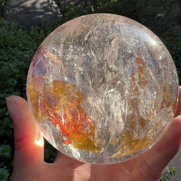Red and orange inclusions spreading across the lower half of the ball