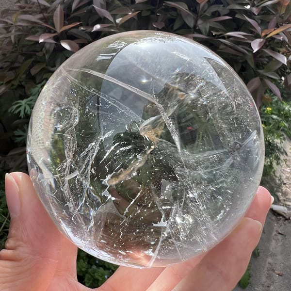 Network of fine lines and veils in the clear quartz in garden light