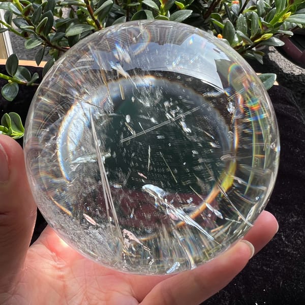Rainbow ring around the sphere with scattered needles inside