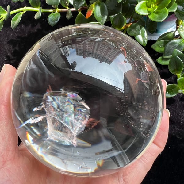 Crystal-in-crystal with sharp straight edges floating inside the clear quartz