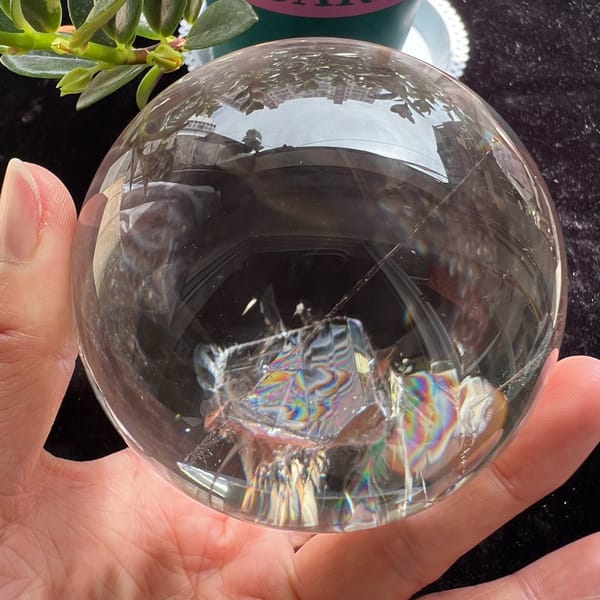 Rainbow stripes across the faces of the included crystal near the base