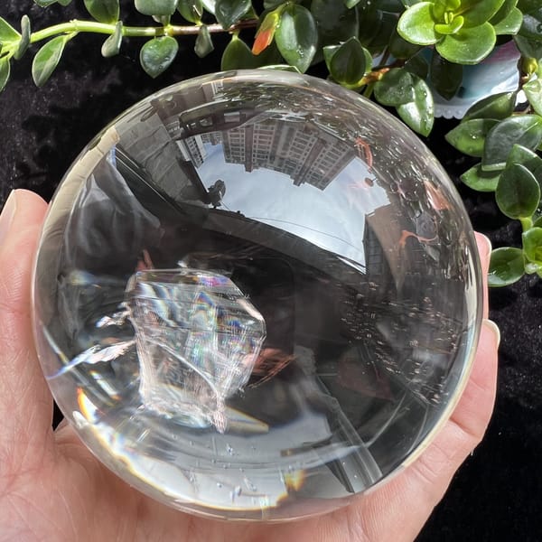 Inner crystal seen face-on with fine lines and a rainbow along its base